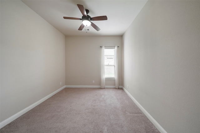 unfurnished room with light carpet and ceiling fan