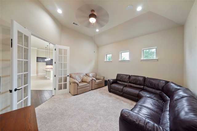 living room with french doors, hardwood / wood-style flooring, vaulted ceiling, and ceiling fan