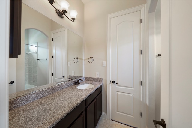 bathroom with tile patterned floors and vanity