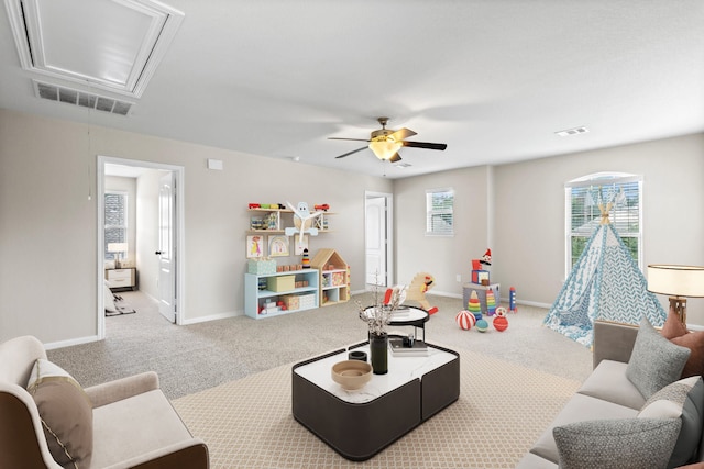 game room with ceiling fan and carpet floors