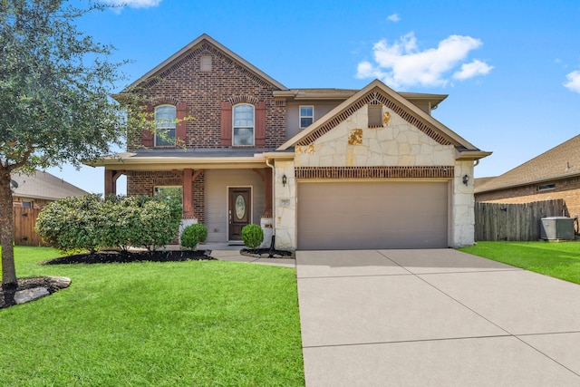 view of front facade with a front yard and a garage