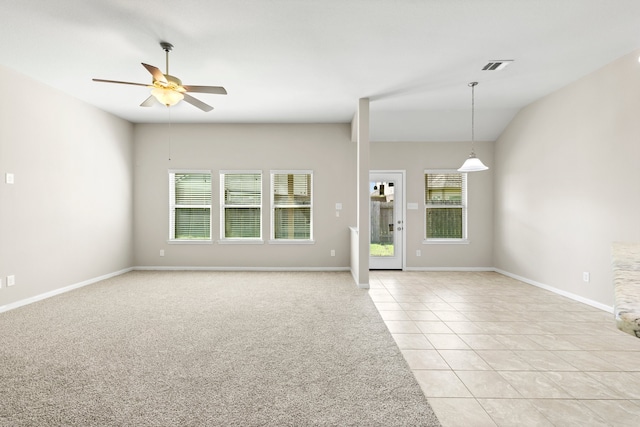 unfurnished room with ceiling fan and light tile patterned floors