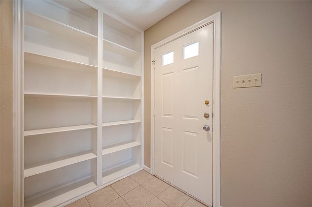 entrance foyer featuring light tile patterned flooring