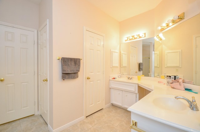 bathroom with tile patterned flooring and vanity