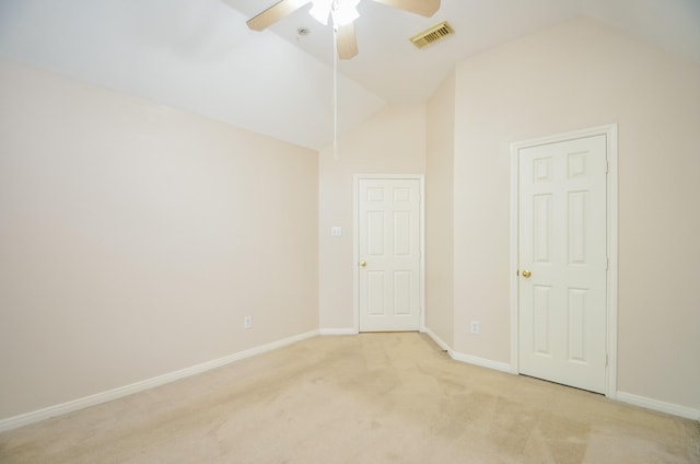 unfurnished room featuring light colored carpet, high vaulted ceiling, and ceiling fan