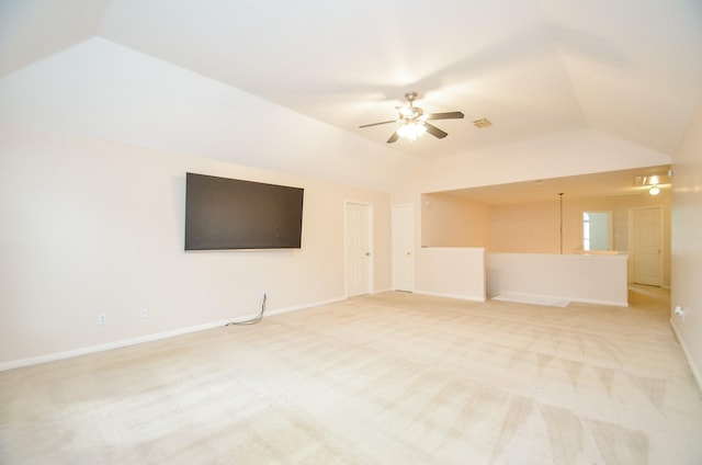 unfurnished living room with ceiling fan, light carpet, and vaulted ceiling