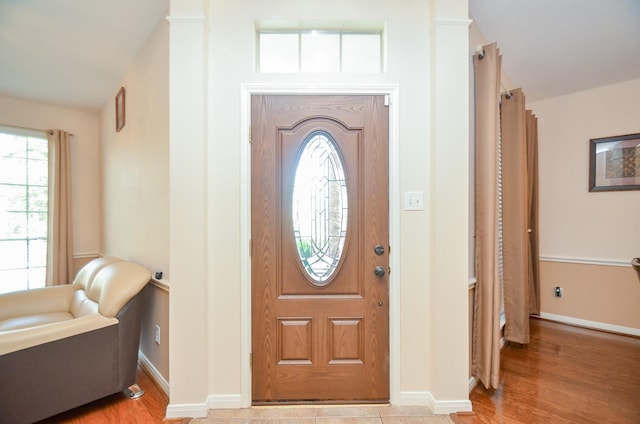 foyer entrance with light hardwood / wood-style flooring