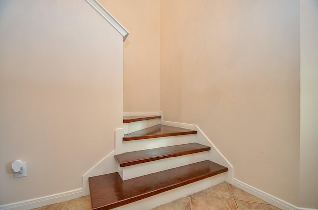 stairs with tile patterned floors