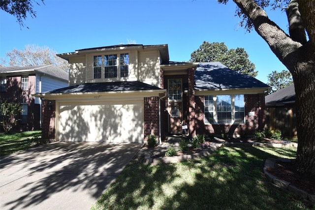 view of front facade with a front yard and a garage