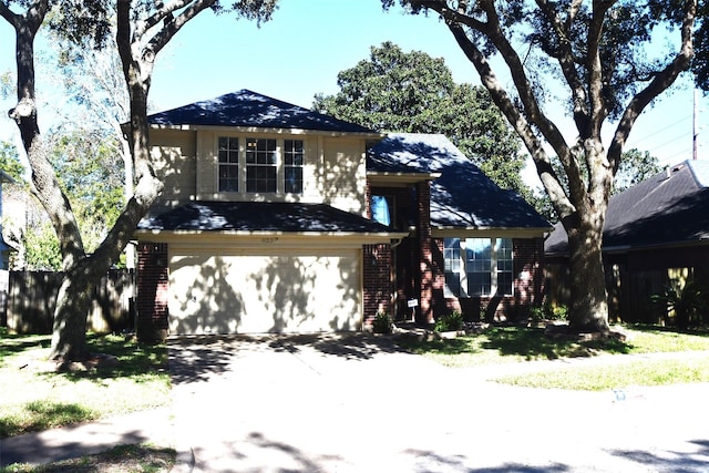 view of front facade featuring a garage and a front lawn