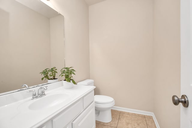 bathroom with tile patterned floors, vanity, and toilet