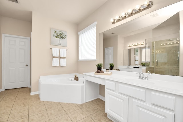 bathroom with tile patterned flooring, vanity, and plus walk in shower