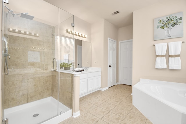 bathroom with tile patterned flooring, vanity, and independent shower and bath