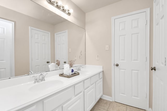 bathroom with tile patterned flooring and vanity