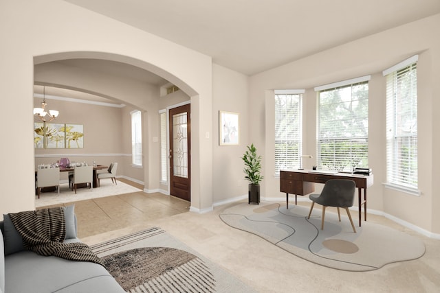 foyer entrance featuring a wealth of natural light, light colored carpet, vaulted ceiling, and an inviting chandelier