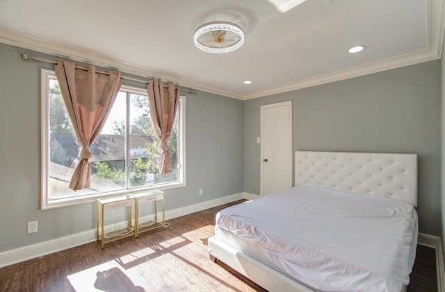 bedroom featuring hardwood / wood-style flooring and ornamental molding