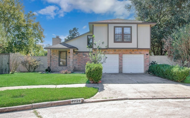 view of front facade with a garage and a front lawn