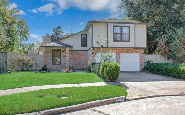 view of front of property with a front lawn and a garage