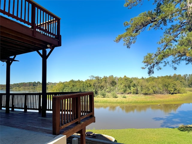 view of dock with a deck with water view