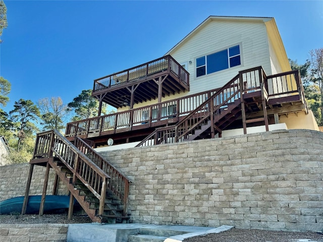 113 Cottonwood Rd, Trinity, TX 75862 - rear view of property with stairs and a deck