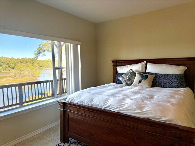113 Cottonwood Rd, Trinity, TX 75862 - bedroom with baseboards and light tile patterned floors