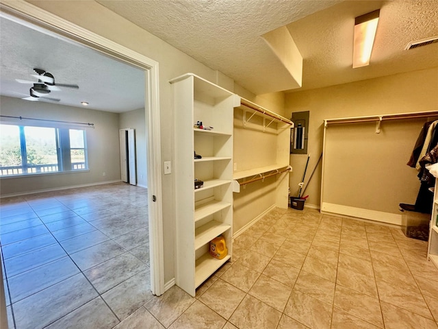 113 Cottonwood Rd, Trinity, TX 75862 - walk in closet with light tile patterned flooring and ceiling fan