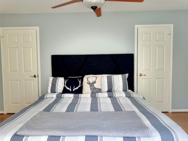 113 Cottonwood Rd, Trinity, TX 75862 - bedroom with wood finished floors and ceiling fan