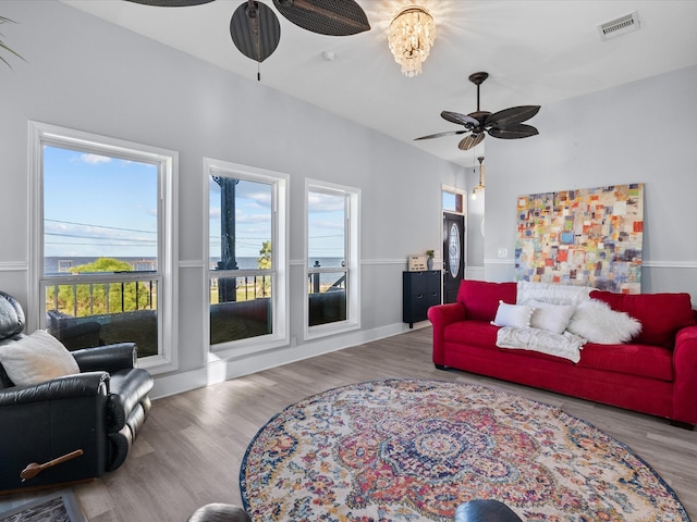 living room with hardwood / wood-style flooring and ceiling fan