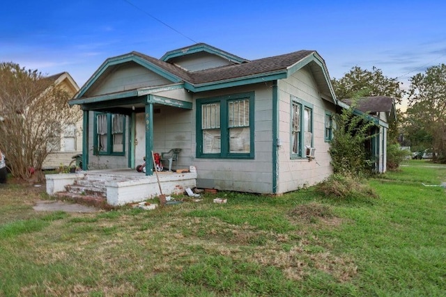 bungalow-style house with a front yard