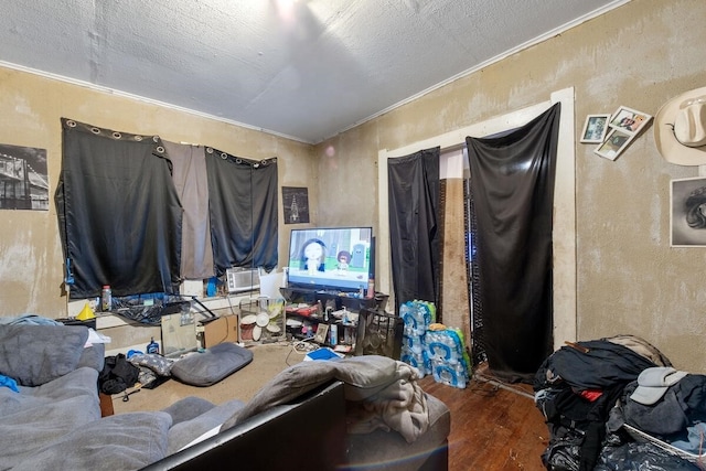 bedroom featuring wood-type flooring and crown molding