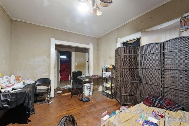 miscellaneous room featuring ornamental molding and hardwood / wood-style flooring