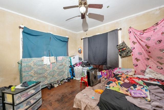 bedroom featuring ceiling fan and ornamental molding