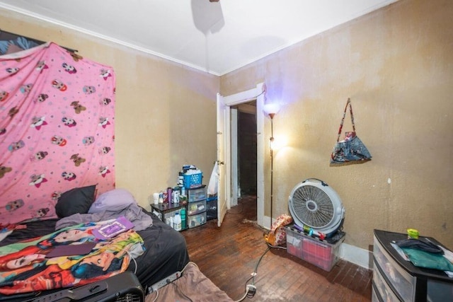 bedroom with ceiling fan and dark hardwood / wood-style flooring