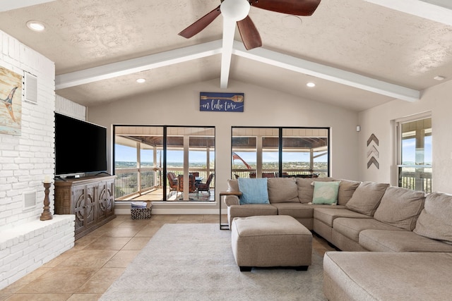 tiled living room with a healthy amount of sunlight and a textured ceiling