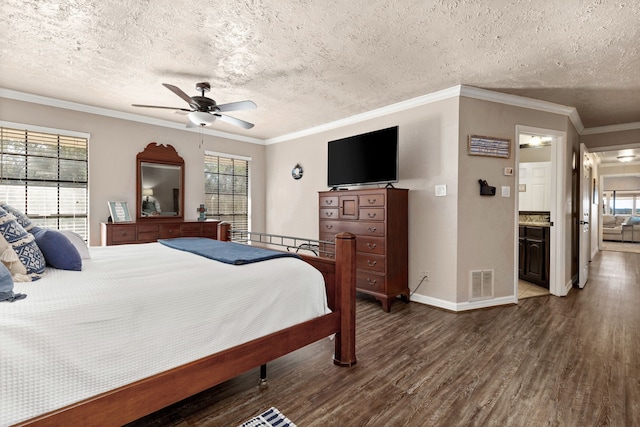 1464 Lakeside Dr W, Canyon Lake, TX 78133 - bedroom with a textured ceiling, dark hardwood / wood-style flooring, ceiling fan, and ornamental molding