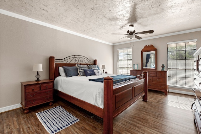 1464 Lakeside Dr W, Canyon Lake, TX 78133 - bedroom with ceiling fan, dark hardwood / wood-style flooring, crown molding, and a textured ceiling