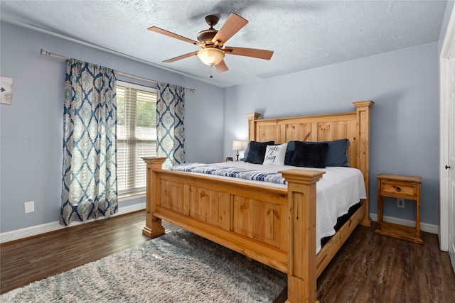 1464 Lakeside Dr W, Canyon Lake, TX 78133 - bedroom with ceiling fan, dark wood-type flooring, and a textured ceiling