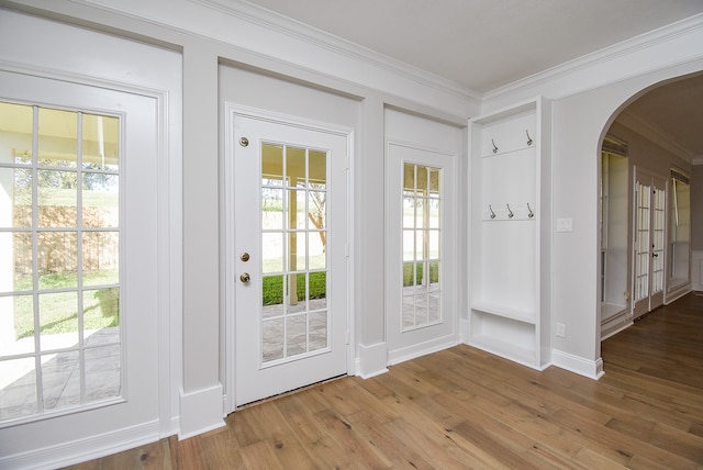 doorway featuring light hardwood / wood-style flooring and ornamental molding