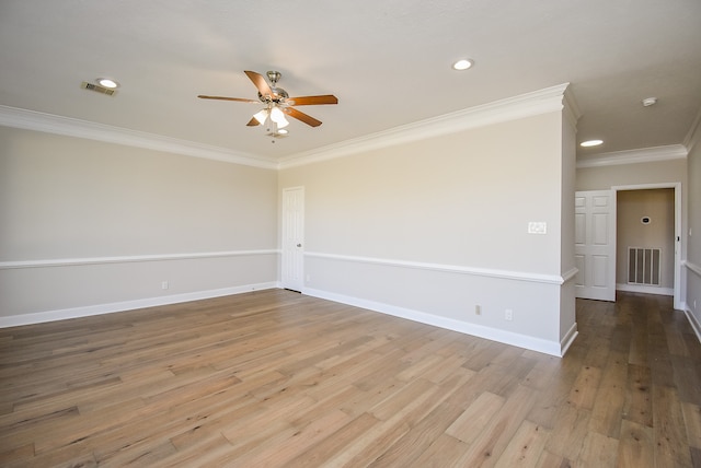 empty room with crown molding, ceiling fan, and hardwood / wood-style flooring