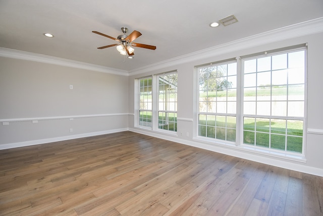 spare room with light hardwood / wood-style flooring, ceiling fan, and ornamental molding