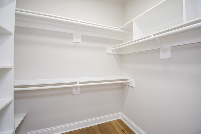 spacious closet featuring hardwood / wood-style flooring