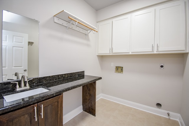 laundry room featuring hookup for a washing machine, sink, cabinets, and hookup for an electric dryer