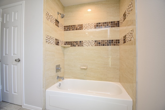 bathroom with tile patterned flooring and tiled shower / bath combo