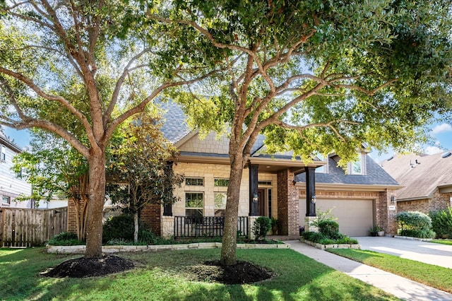 view of front of home featuring a garage and a front lawn