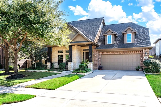 view of front of property featuring a garage and a front yard