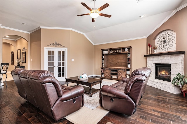 living room with french doors, ornamental molding, ceiling fan, dark wood-type flooring, and lofted ceiling