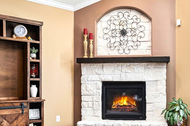 interior details featuring built in shelves, a stone fireplace, and ornamental molding