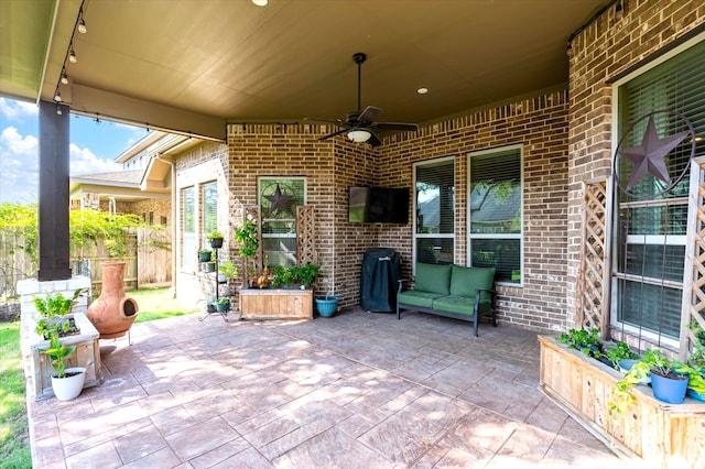 view of patio featuring ceiling fan