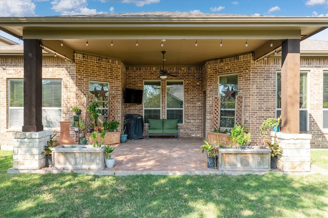 view of patio / terrace featuring ceiling fan