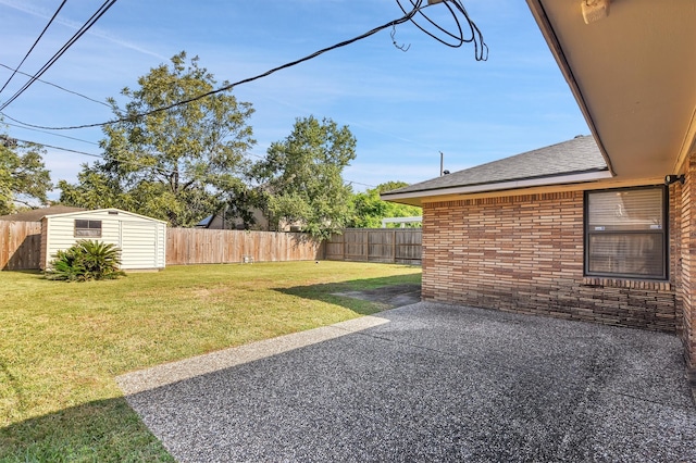 view of yard with a patio area and a storage unit